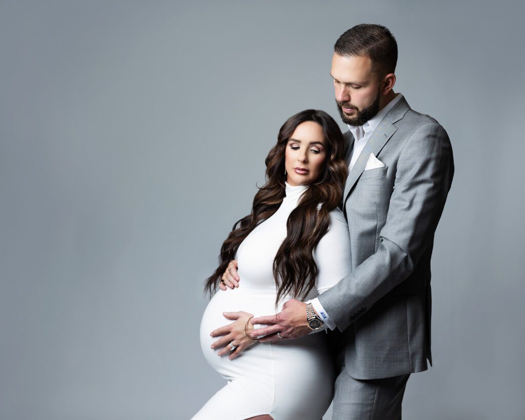 Expectant couple photographed together during a South Jersey maternity session